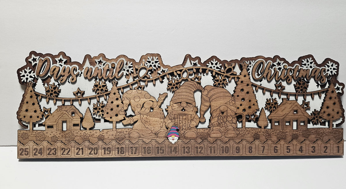 Wooden Christmas countdown calendar with festive design on a white background